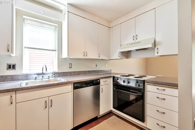 2709 SW 2nd Ave Unit 201, Portland, OR 97201 - kitchen featuring a sink, white cabinetry, a toaster, and stainless steel appliances
