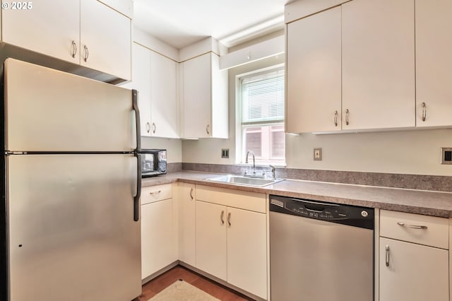 2709 SW 2nd Ave Unit 201, Portland, OR 97201 - unfurnished living room featuring a glass covered fireplace, baseboards, recessed lighting, and wood finished floors