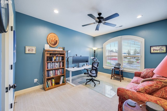 home office featuring carpet floors, baseboards, visible vents, and ceiling fan