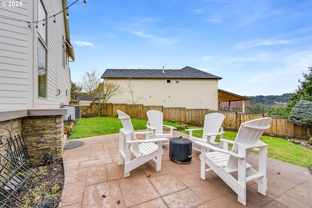 view of patio featuring a fenced backyard and central air condition unit