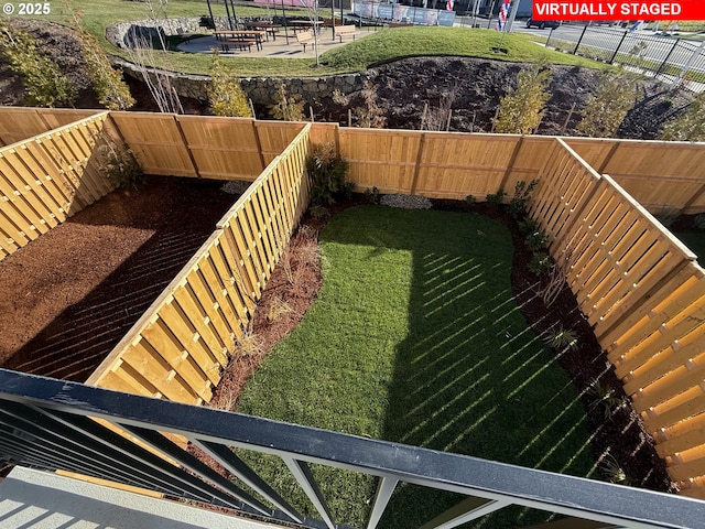 view of yard featuring a patio area and a fenced backyard