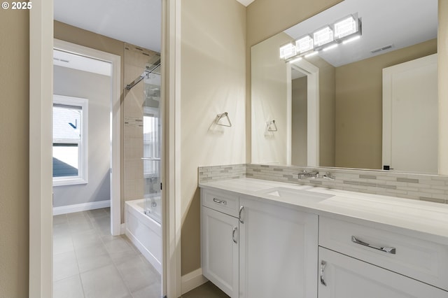 bathroom featuring shower / bath combination, tile patterned floors, tasteful backsplash, and vanity