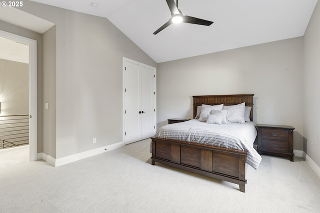 carpeted bedroom featuring ceiling fan and lofted ceiling