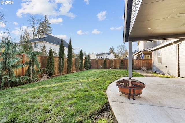 view of yard with an outdoor fire pit and a patio