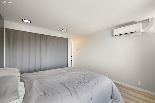 607 Montara Way, Eugene, OR 97405 - bedroom with a wall mounted air conditioner and light wood-style floors