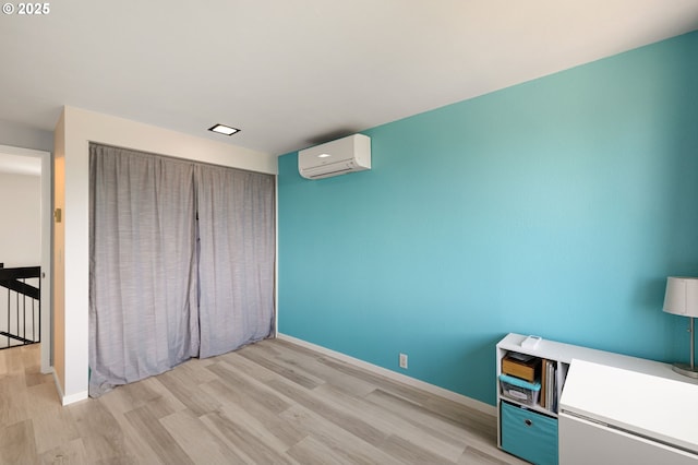 607 Montara Way, Eugene, OR 97405 - unfurnished bedroom with a wall mounted air conditioner and light wood-style floors