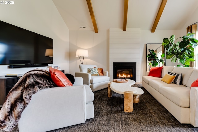 living room featuring a large fireplace