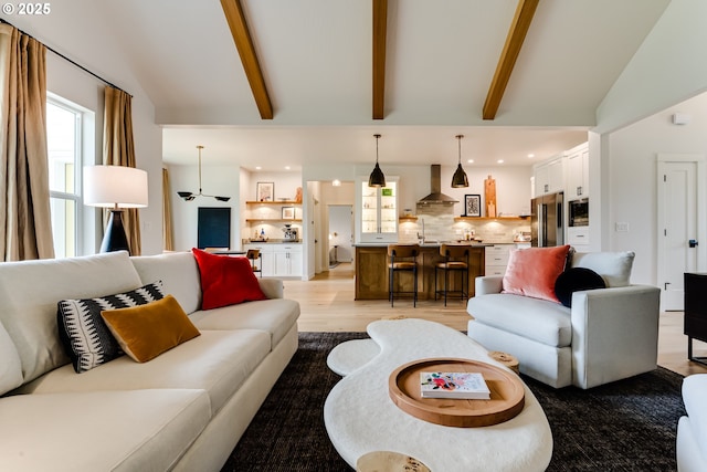 living room with light wood finished floors and recessed lighting