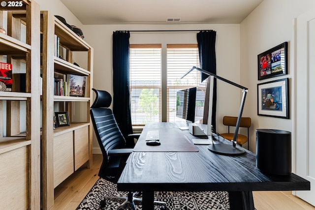 office area with light wood-style floors
