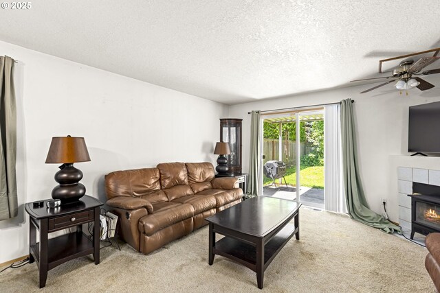9206 N Smith St, Portland, OR 97203 - living room with a textured ceiling, light carpet, a ceiling fan, and a fireplace
