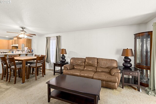 9206 N Smith St, Portland, OR 97203 - living area featuring light colored carpet, a textured ceiling, and ceiling fan