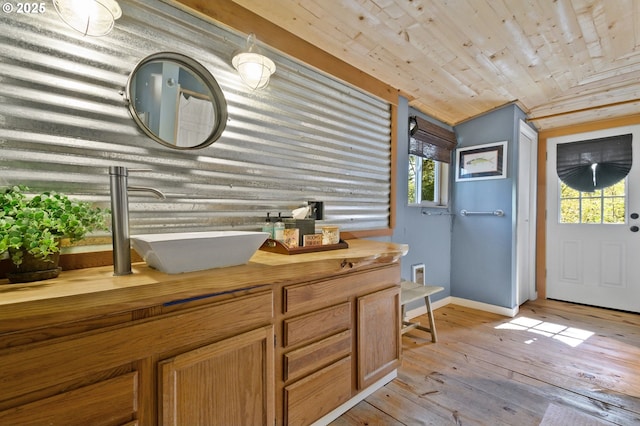 625 Wilson Rd, Mosier, OR 97040 - entrance foyer featuring wood ceiling, plenty of natural light, baseboards, and light wood-type flooring