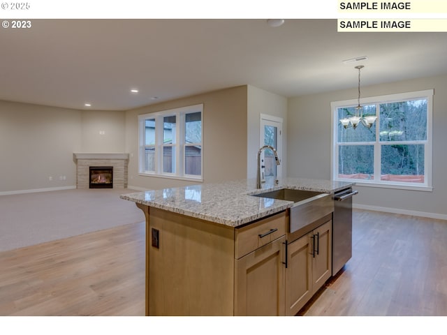 16513 SE Smith Rock St Unit 732, Happy Valley, OR 97086 - kitchen with a sink, light wood-type flooring, dishwasher, a chandelier, and decorative light fixtures