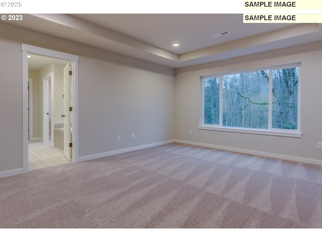 16513 SE Smith Rock St Unit 732, Happy Valley, OR 97086 - carpeted spare room featuring recessed lighting, baseboards, and a tray ceiling