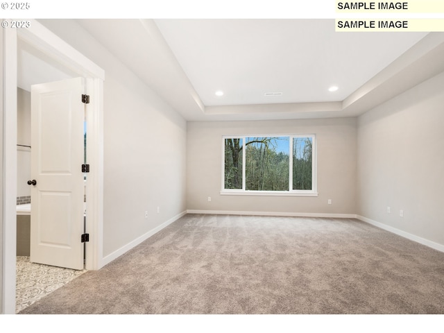 16513 SE Smith Rock St Unit 732, Happy Valley, OR 97086 - carpeted empty room with baseboards, a raised ceiling, and recessed lighting