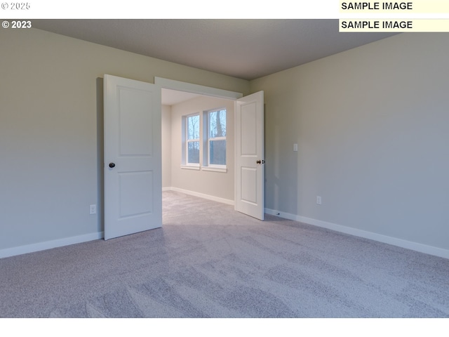16513 SE Smith Rock St Unit 732, Happy Valley, OR 97086 - carpeted spare room with baseboards