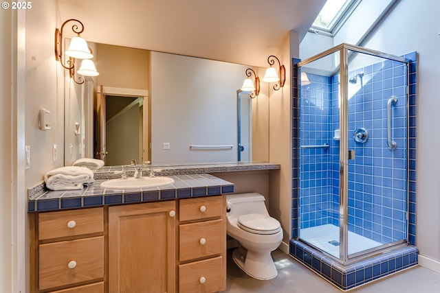 2405 Blacktail Dr, Eugene, OR 97405 - bathroom featuring a skylight, vanity, toilet, and a stall shower