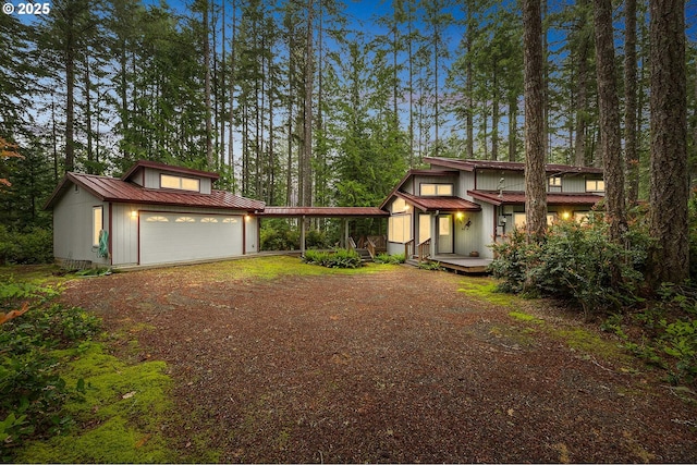 231 E Dunoon Pl, Shelton, WA 98584 - view of front of property with a carport, dirt driveway, metal roof, and a garage