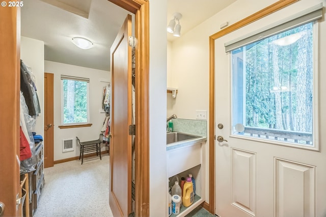 231 E Dunoon Pl, Shelton, WA 98584 - doorway with carpet, baseboards, and a sink