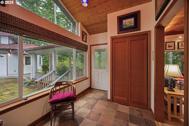 231 E Dunoon Pl, Shelton, WA 98584 - foyer entrance with baseboards, stone finish floors, plenty of natural light, wooden ceiling, and high vaulted ceiling