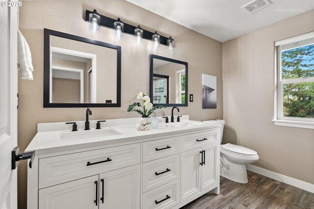 17665 SW Elder View Dr, Sherwood, OR 97140 - full bathroom featuring visible vents, a sink, toilet, and wood finished floors
