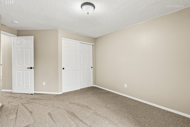 17665 SW Elder View Dr, Sherwood, OR 97140 - unfurnished bedroom featuring a closet, carpet flooring, a textured ceiling, and baseboards