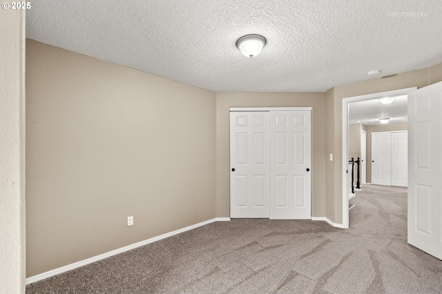 17665 SW Elder View Dr, Sherwood, OR 97140 - unfurnished bedroom with a textured ceiling, a closet, baseboards, and carpet floors