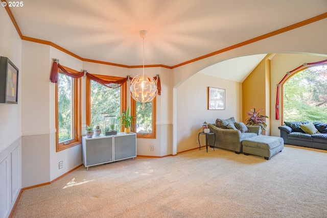 interior space with arched walkways, a wealth of natural light, baseboards, and carpet floors