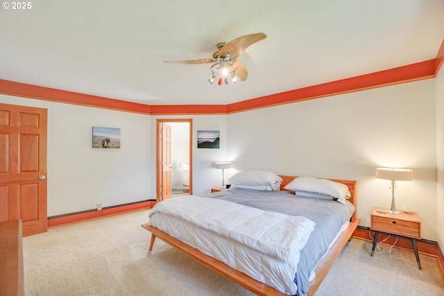 carpeted bedroom with a ceiling fan