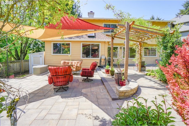 view of patio featuring fence, a pergola, and an outdoor living space