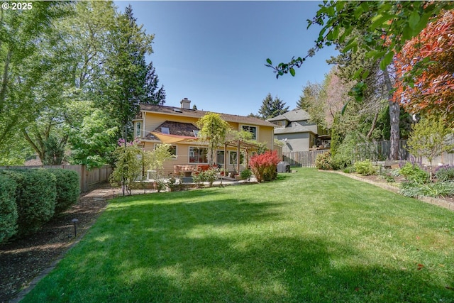 view of yard with a fenced backyard