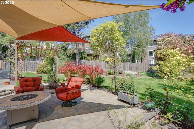 view of patio featuring an outdoor fire pit and fence private yard