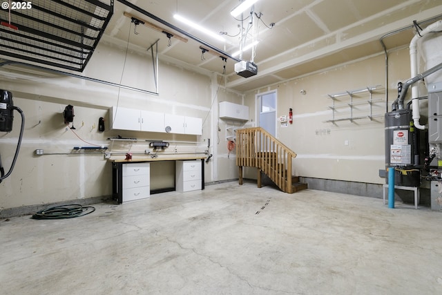 garage with water heater and a garage door opener