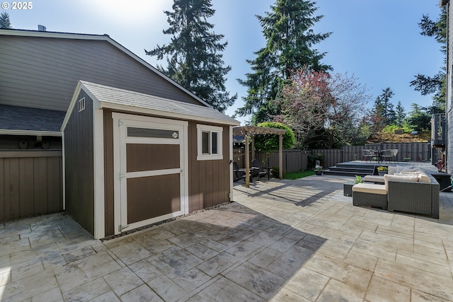view of shed featuring a fenced backyard