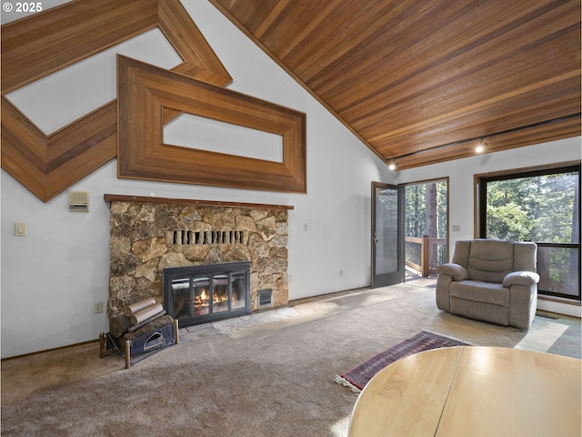 unfurnished living room with wood ceiling, light colored carpet, a fireplace, and vaulted ceiling