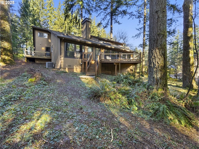 back of property featuring a wooden deck and central air condition unit