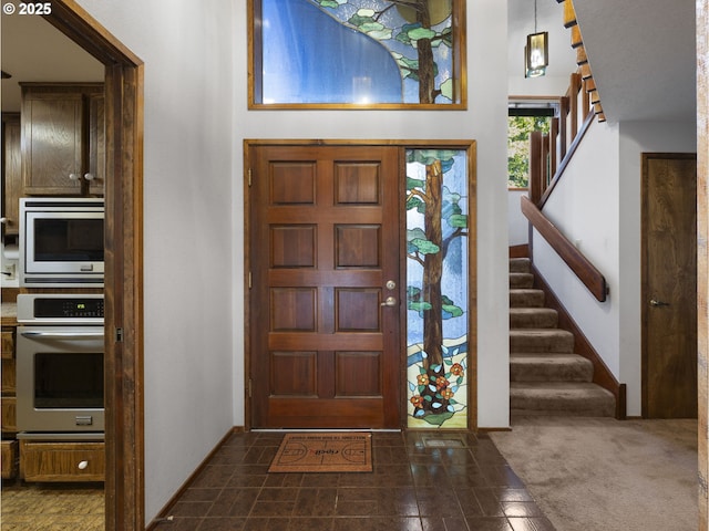 view of carpeted foyer