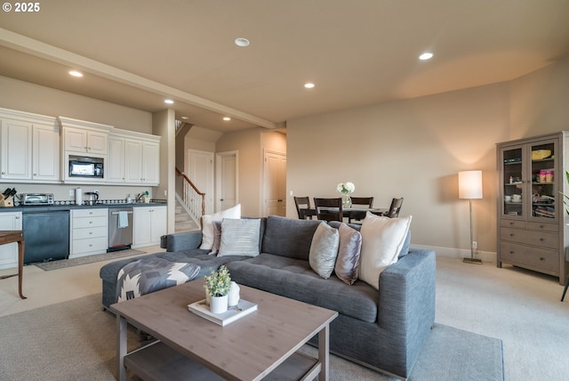 2640 NW Birkendene St, Portland, OR 97229 - living area featuring recessed lighting, light colored carpet, stairs, and baseboards