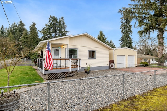 view of front of home featuring a front yard, a fenced backyard, and a deck