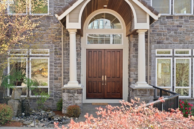 entrance to property with stone siding