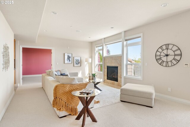 living area with a fireplace, baseboards, recessed lighting, and light colored carpet