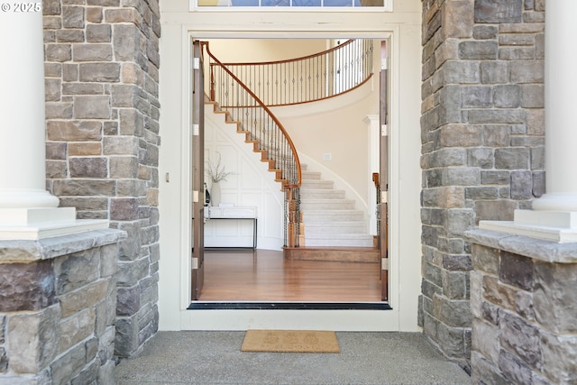entrance to property featuring stone siding