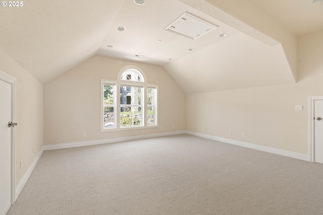 bonus room featuring lofted ceiling, light carpet, baseboards, and recessed lighting