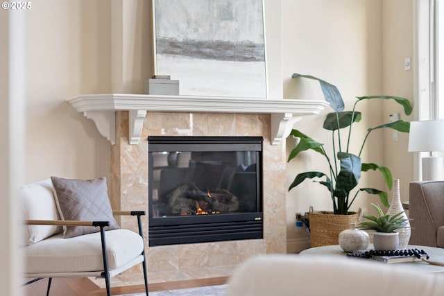 interior details featuring a tile fireplace