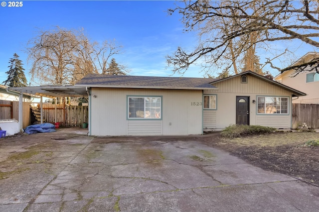 single story home with a carport