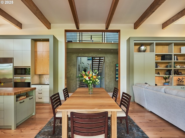 448 NW Skyline Blvd, Portland, OR 97229 - dining space with light wood-style flooring and beamed ceiling
