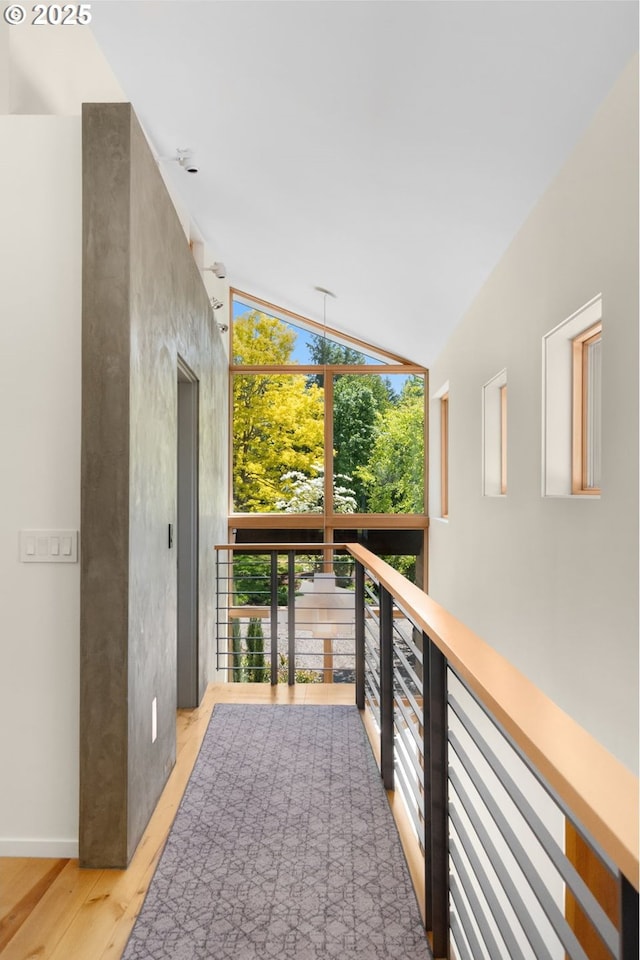 448 NW Skyline Blvd, Portland, OR 97229 - corridor with light wood-style flooring, an upstairs landing, and lofted ceiling
