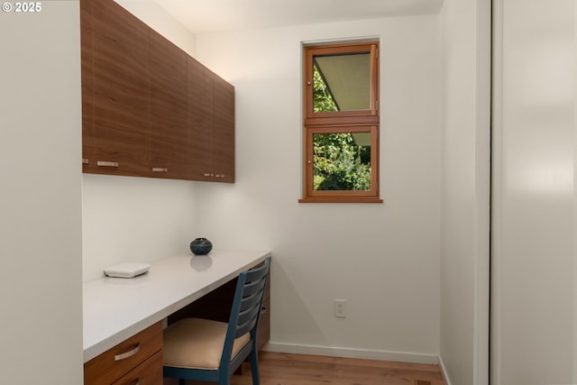 448 NW Skyline Blvd, Portland, OR 97229 - office space with built in desk, light wood-style flooring, and baseboards