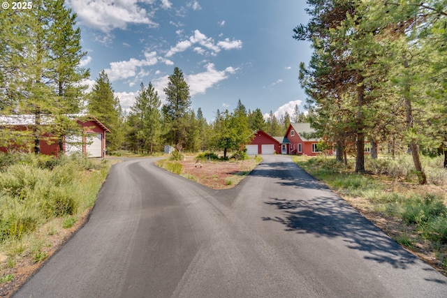 view of street featuring aphalt driveway