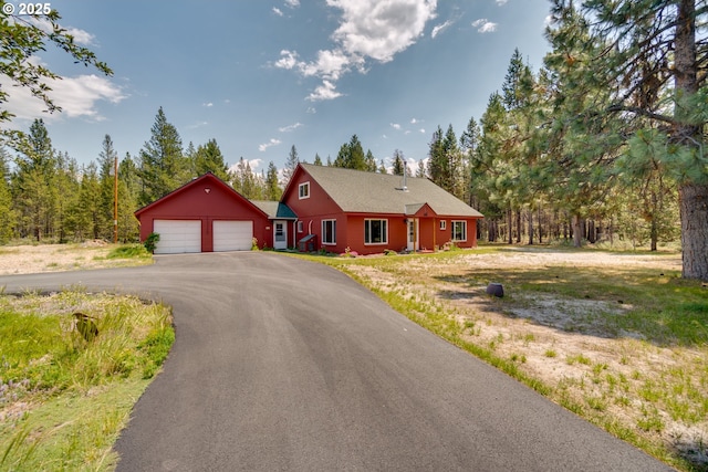 view of front of property with a detached garage